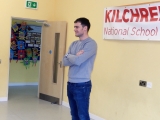 <p>David speaking to the school </p>